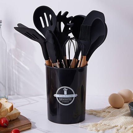 Set di utensili da cucina in silicone con il manico in legno e con il secchiello